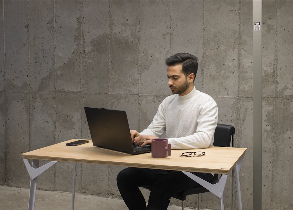 Man working through his finances on a laptop