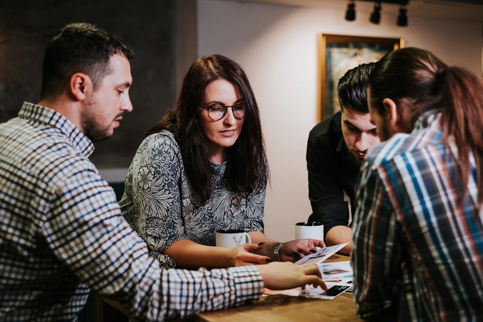 Colleagues reviewing documents together at a table